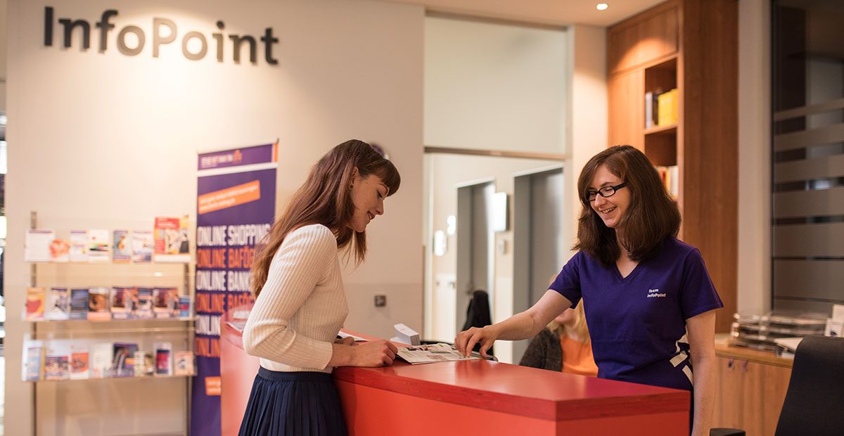a student gladly receives first-level information at a service and information point from the student services